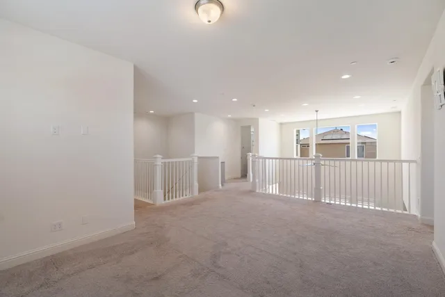 a view of a livingroom with a dinning room and staircase