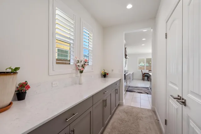 a spacious bathroom with a sink double vanity and a mirror