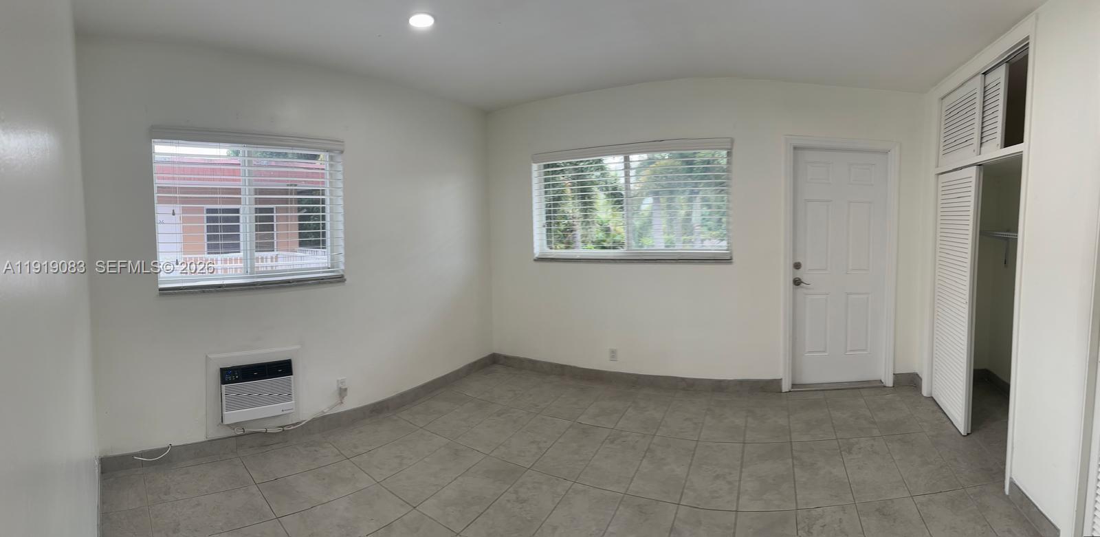2838 Madison Street, Unit 19 Hollywood, FL 33020 - Photo 4 of 5 an empty room with windows