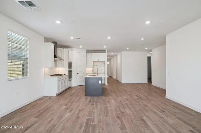 a view of kitchen with stainless steel appliances refrigerator microwave and stove