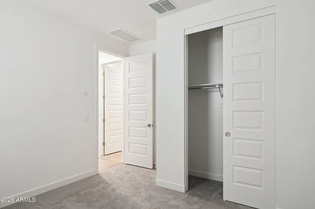 a bathroom with a granite countertop bathtub shower and toilet