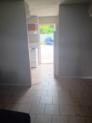 a view of an empty room with a window