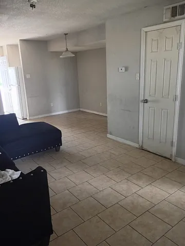 a view of a livingroom with furniture and cabinets