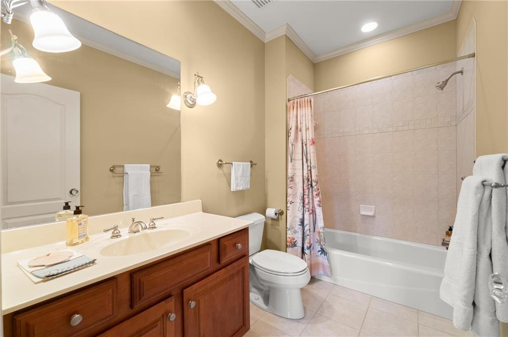 322 Edwards Brook Lane Canton, GA 30115 - Photo 58 of 99 a bathroom with a sink a toilet and shower