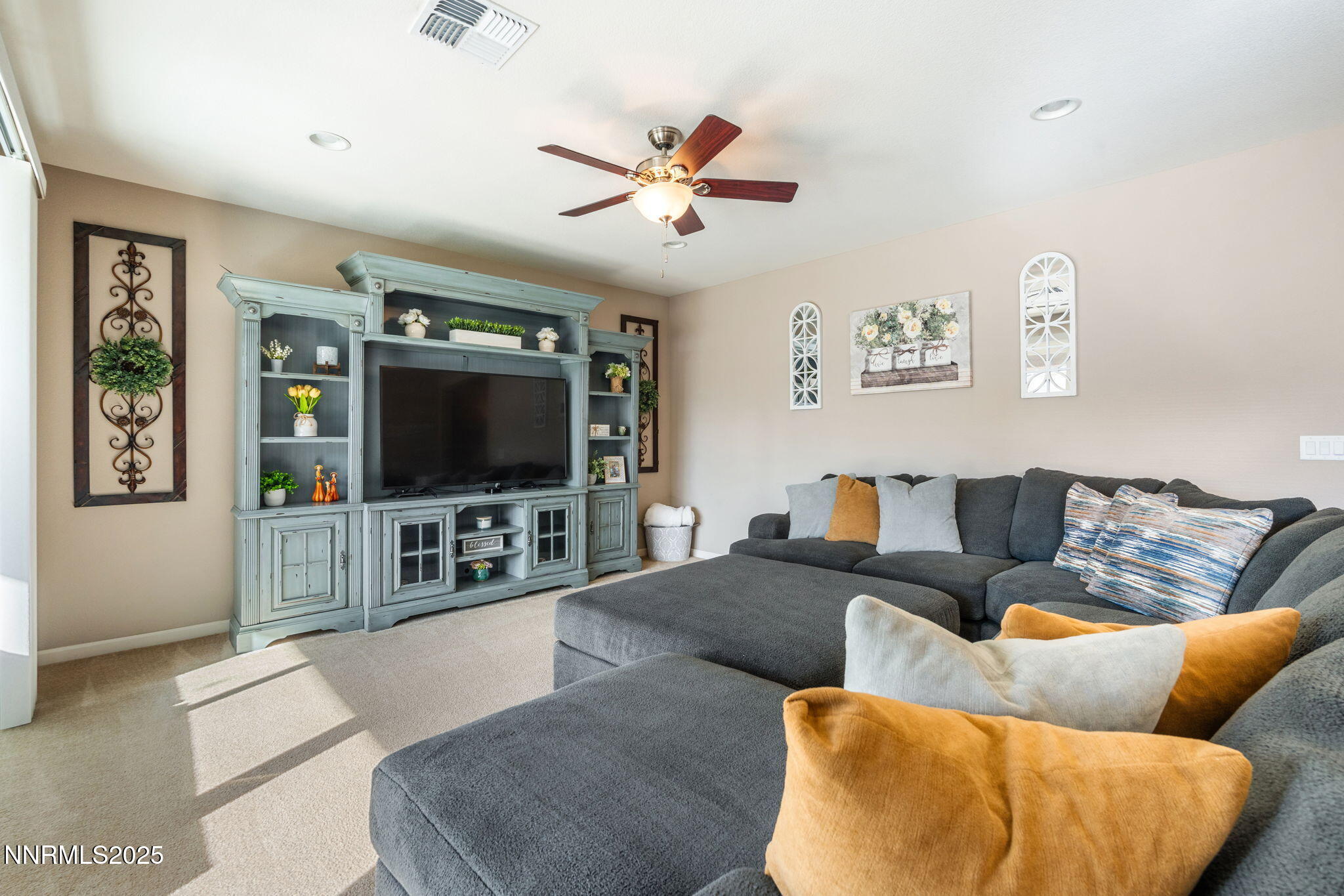 3090 Show Jumper Lane Reno, NV 89521 - Photo 17 of 42 a living room with furniture and a flat screen tv