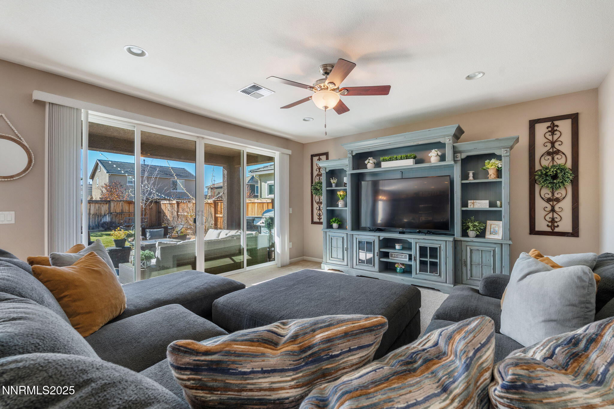 3090 Show Jumper Lane Reno, NV 89521 - Photo 18 of 42 a living room with furniture and a flat screen tv