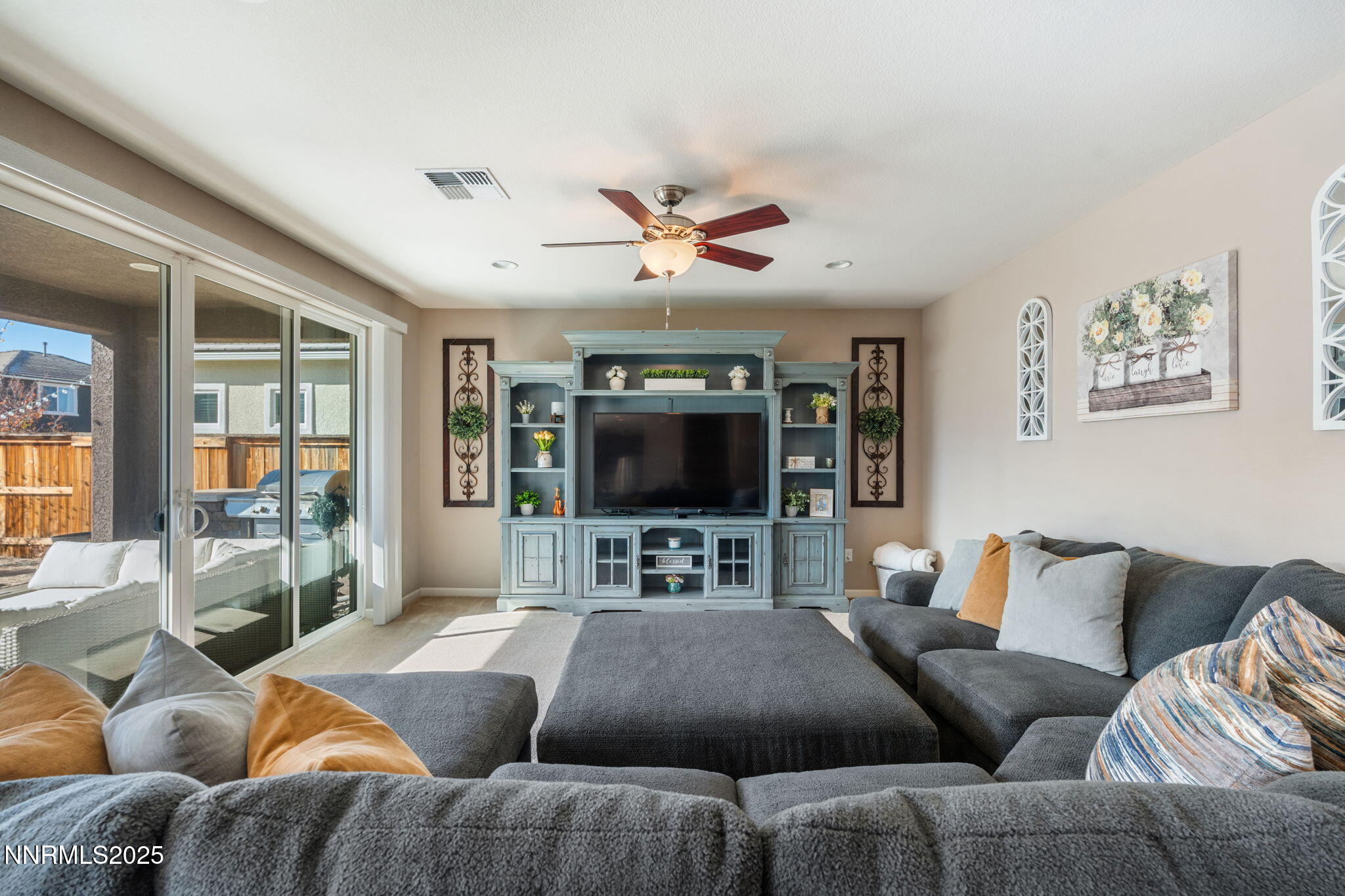 3090 Show Jumper Lane Reno, NV 89521 - Photo 19 of 42 a living room with furniture and a flat screen tv