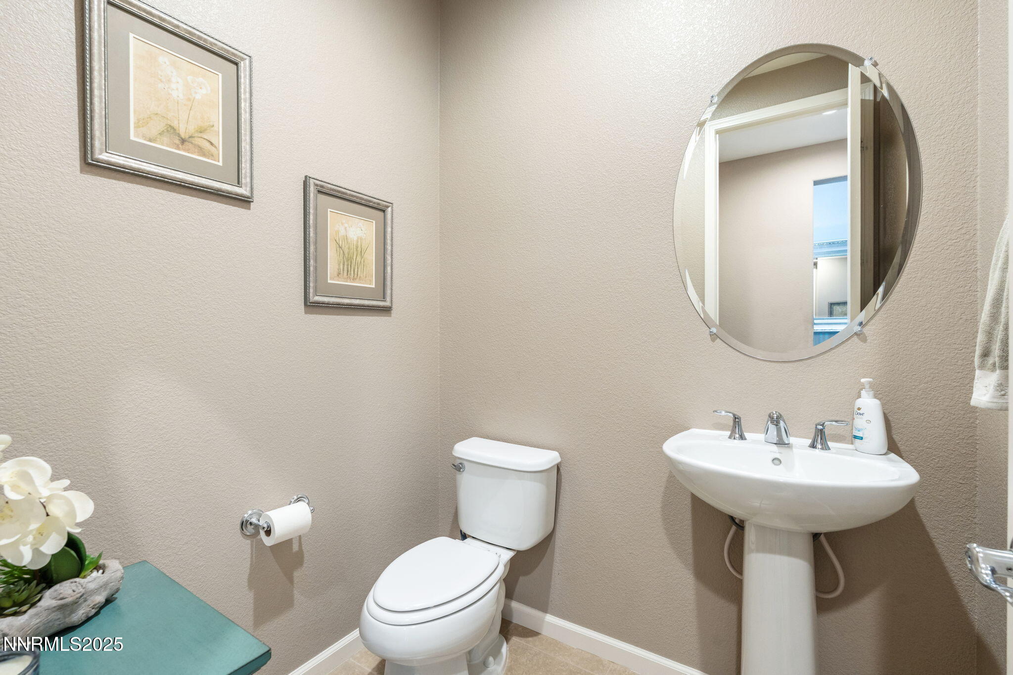 3090 Show Jumper Lane Reno, NV 89521 - Photo 20 of 42 a bathroom with a toilet sink and mirror