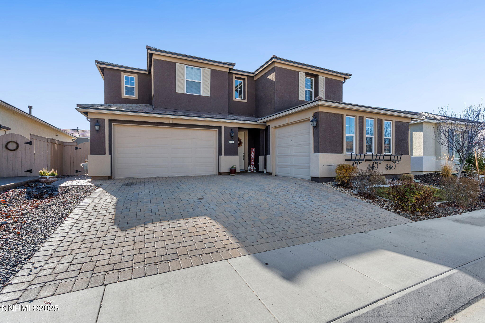 3090 Show Jumper Lane Reno, NV 89521 - Photo 2 of 42 a front view of a house with yard