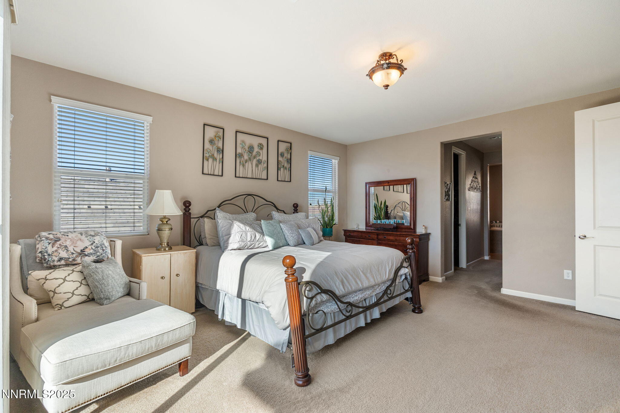 3090 Show Jumper Lane Reno, NV 89521 - Photo 22 of 42 a spacious bedroom with a bed and window