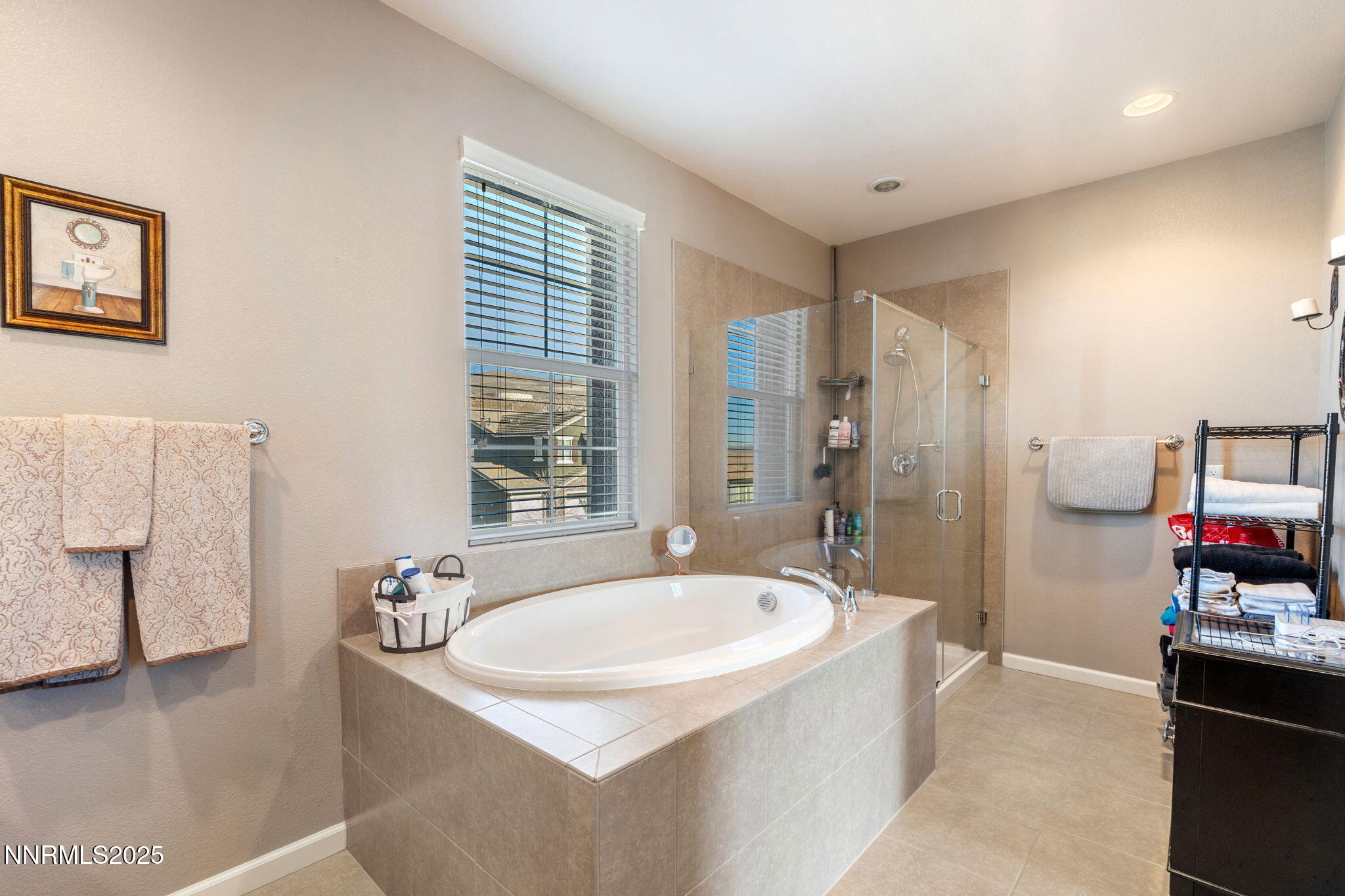 3090 Show Jumper Lane Reno, NV 89521 - Photo 28 of 42 a bathroom with a tub sink and mirror