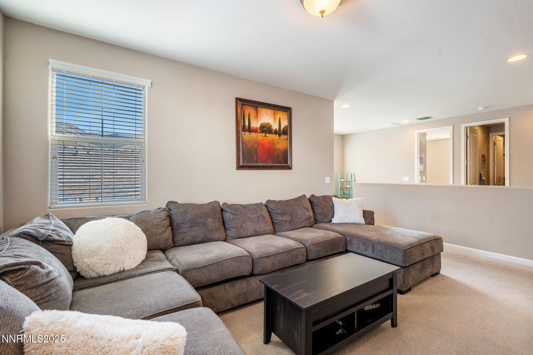 3090 Show Jumper Lane Reno, NV 89521 - Photo 32 of 42 a living room with furniture and a window