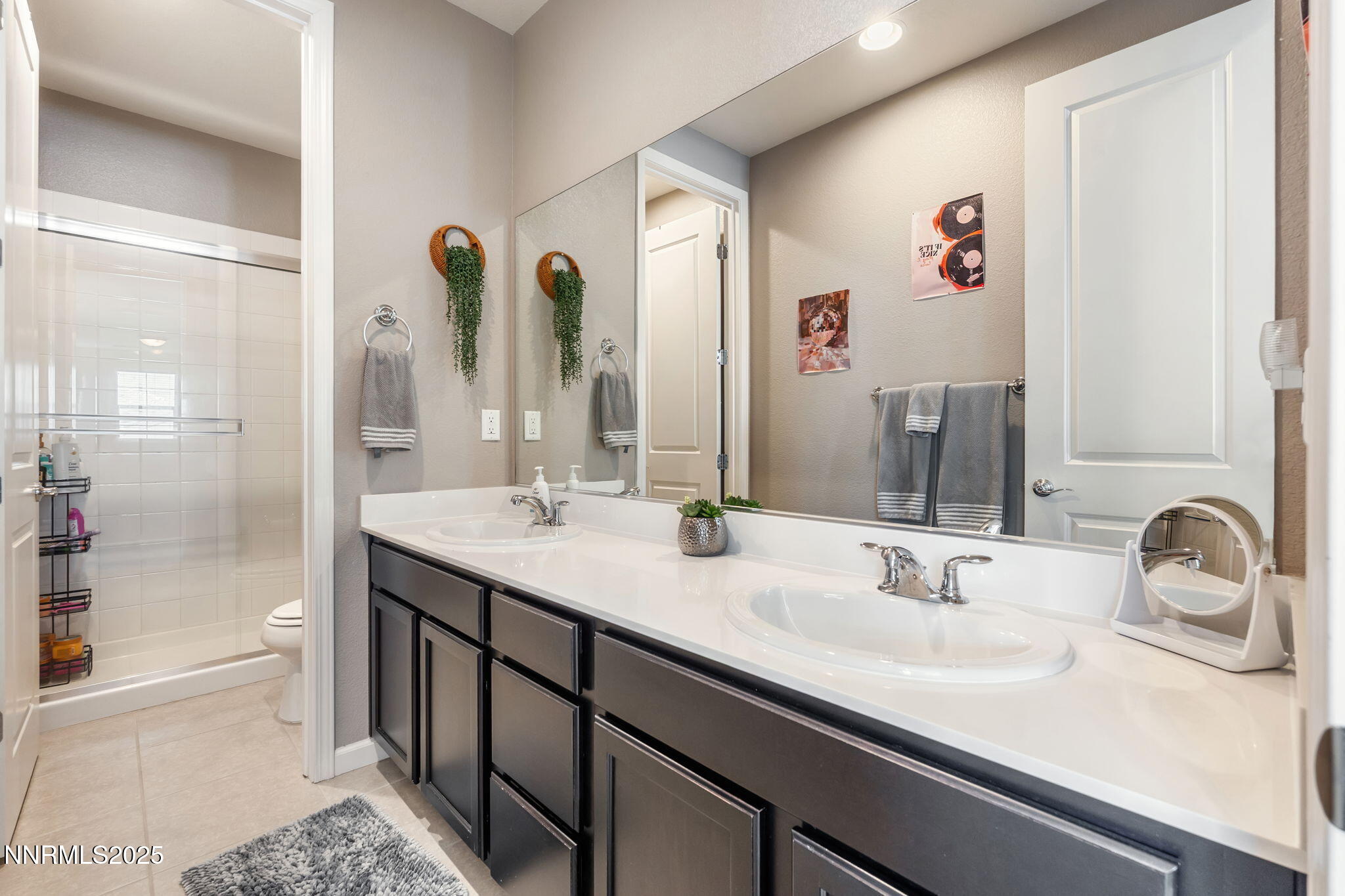3090 Show Jumper Lane Reno, NV 89521 - Photo 36 of 42 a bathroom with a double vanity sink mirror and double