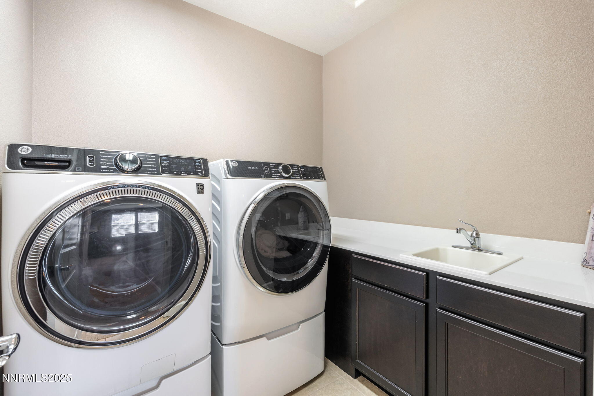 3090 Show Jumper Lane Reno, NV 89521 - Photo 37 of 42 a utility room with dryer and washer