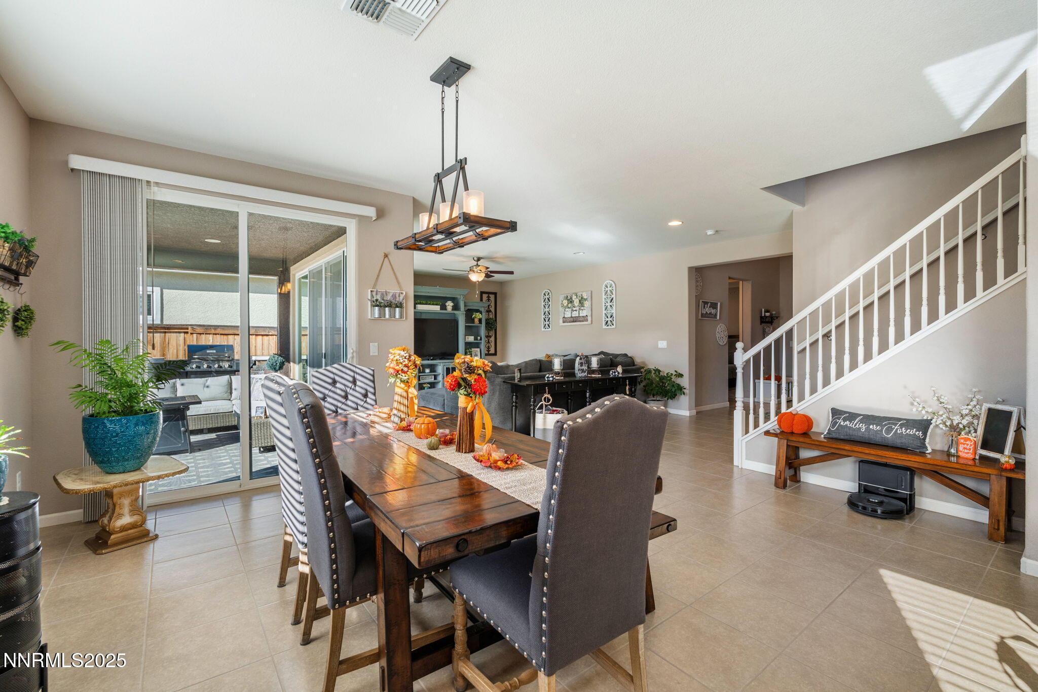 3090 Show Jumper Lane Reno, NV 89521 - Photo 6 of 42 a living room with furniture and a chandelier