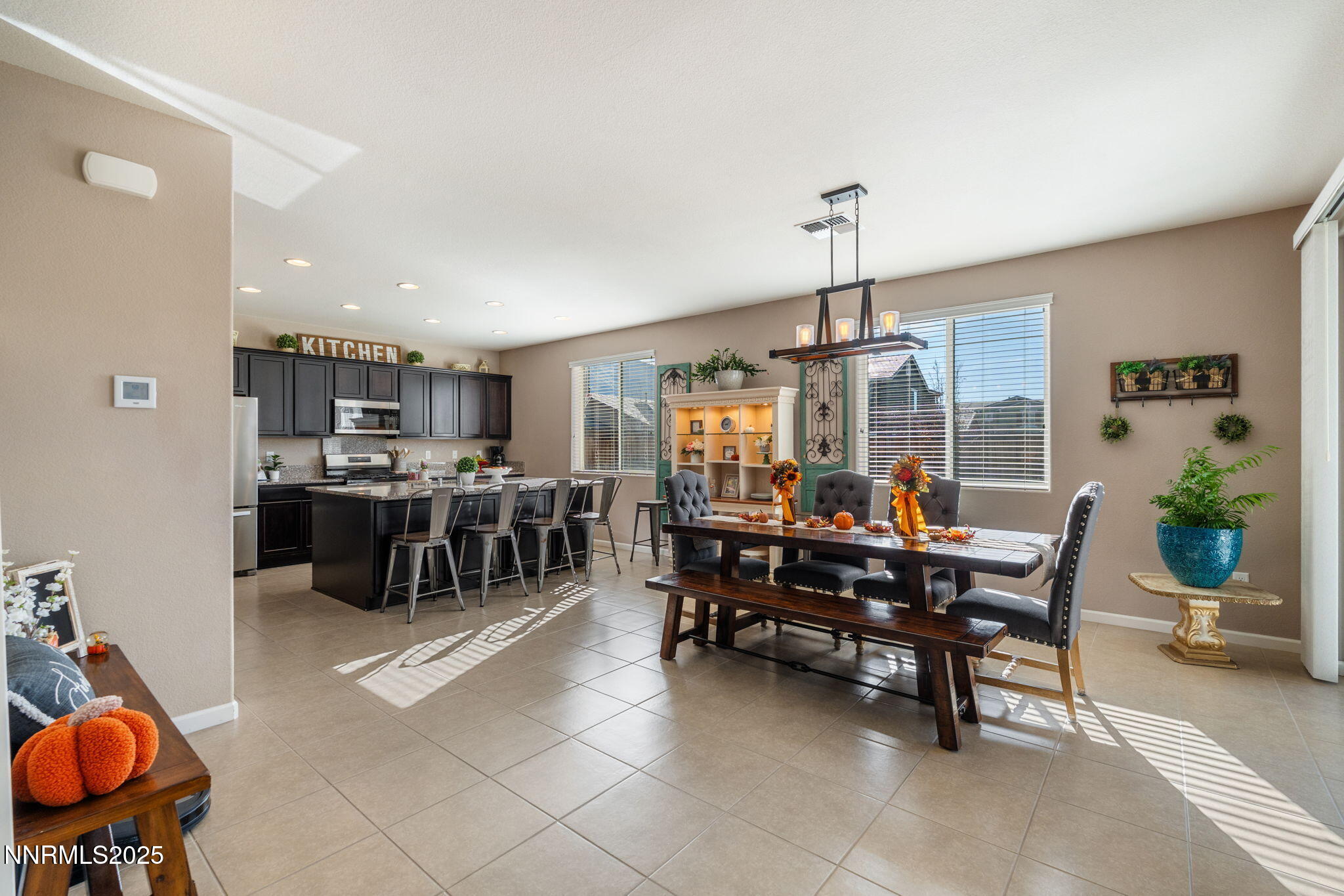 3090 Show Jumper Lane Reno, NV 89521 - Photo 8 of 42 a view of a dining room with furniture window and outside view