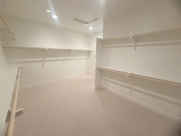 a view of an empty walk in closet