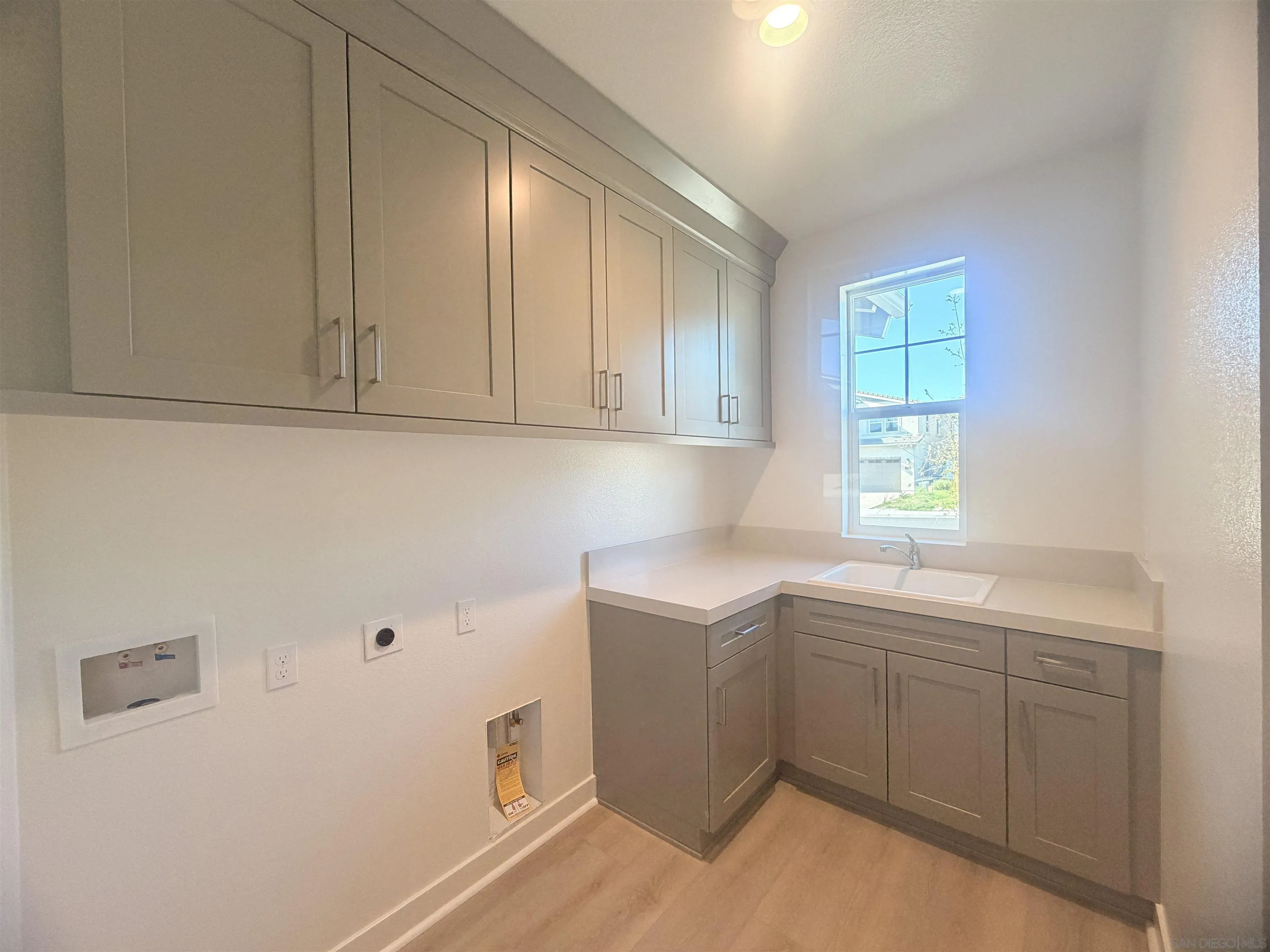 13765 Holly Oak Way Poway, CA 92064 - Photo 29 of 31 a utility room with a sink dryer and washer