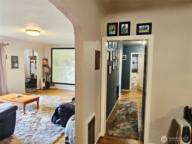 a living room with furniture and a rug