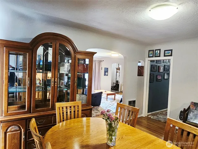 a view of a livingroom with furniture window and wooden floor