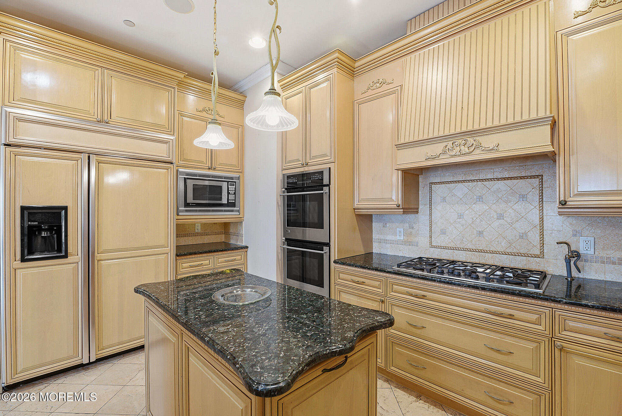 141 Riviera Drive Long Branch, NJ 07740 - Photo 12 of 41 a kitchen with stainless steel appliances granite countertop a sink and a refrigerator