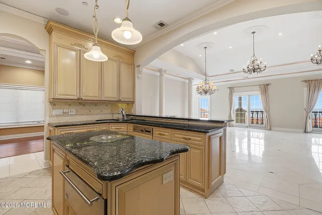a kitchen with stainless steel appliances a refrigerator sink and cabinets