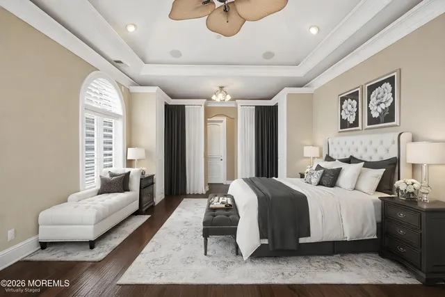 a bathroom with double vanity and a mirror