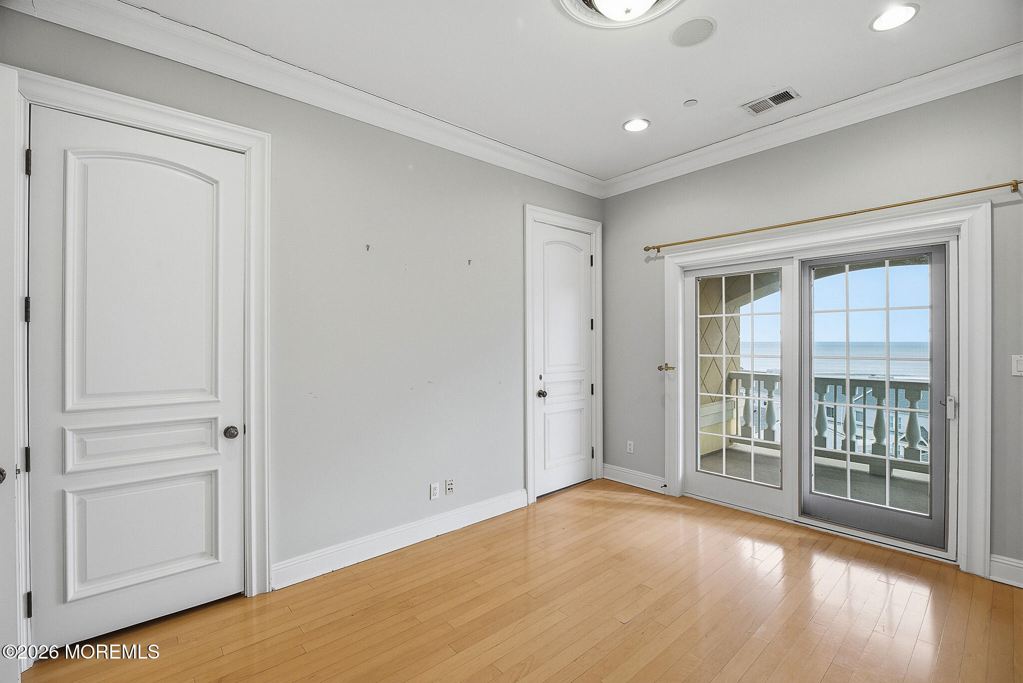 141 Riviera Drive Long Branch, NJ 07740 - Photo 22 of 41 a view of empty room with wooden floor