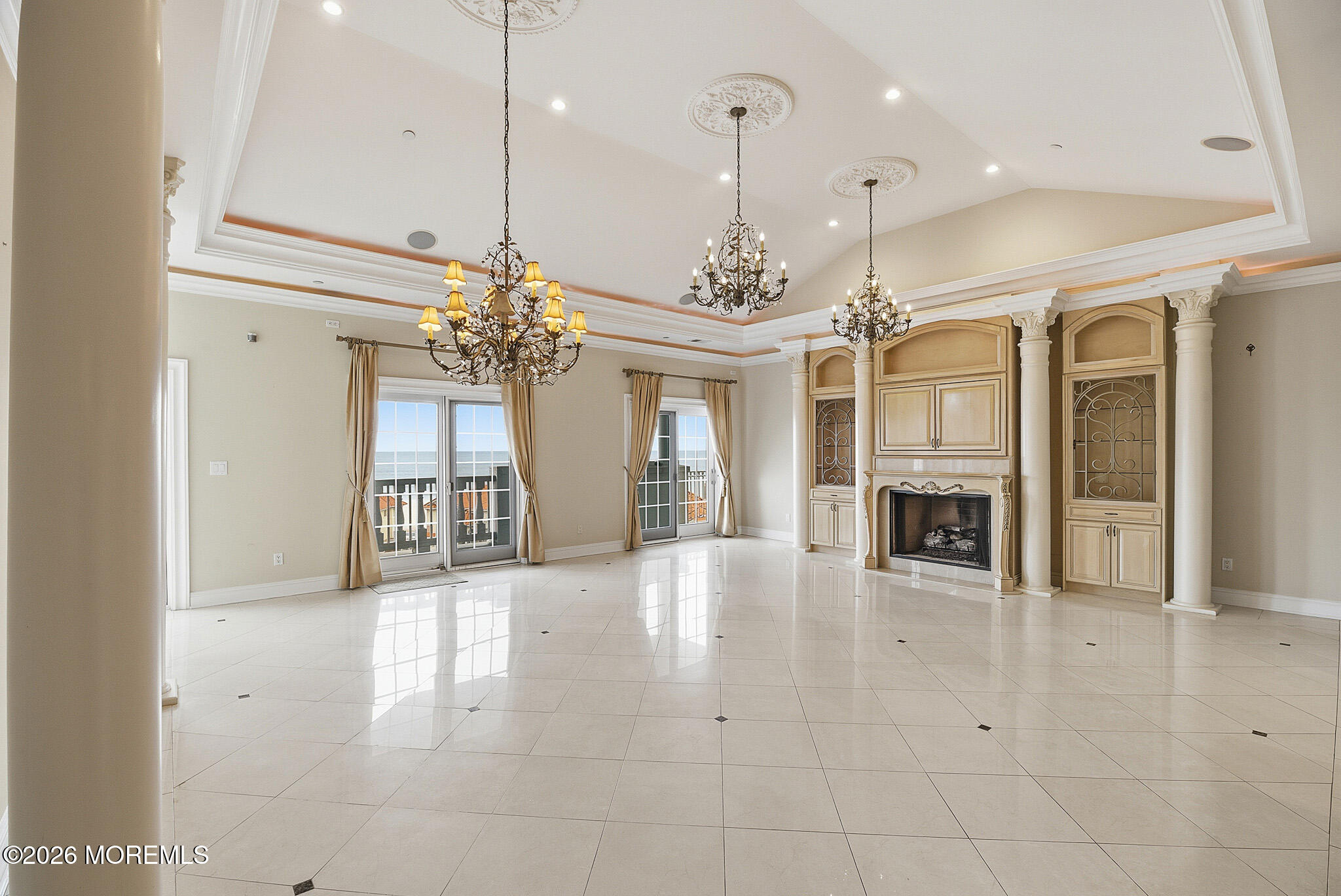 141 Riviera Drive Long Branch, NJ 07740 - Photo 9 of 41 a view of a big room with chandelier and fireplace