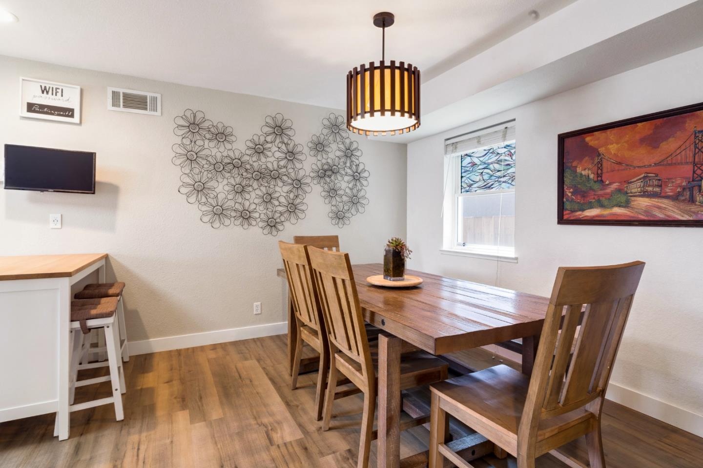 174 Pacific Avenue Pacifica, CA 94044 - Photo 11 of 31 a view of a dining room with furniture and wooden floor
