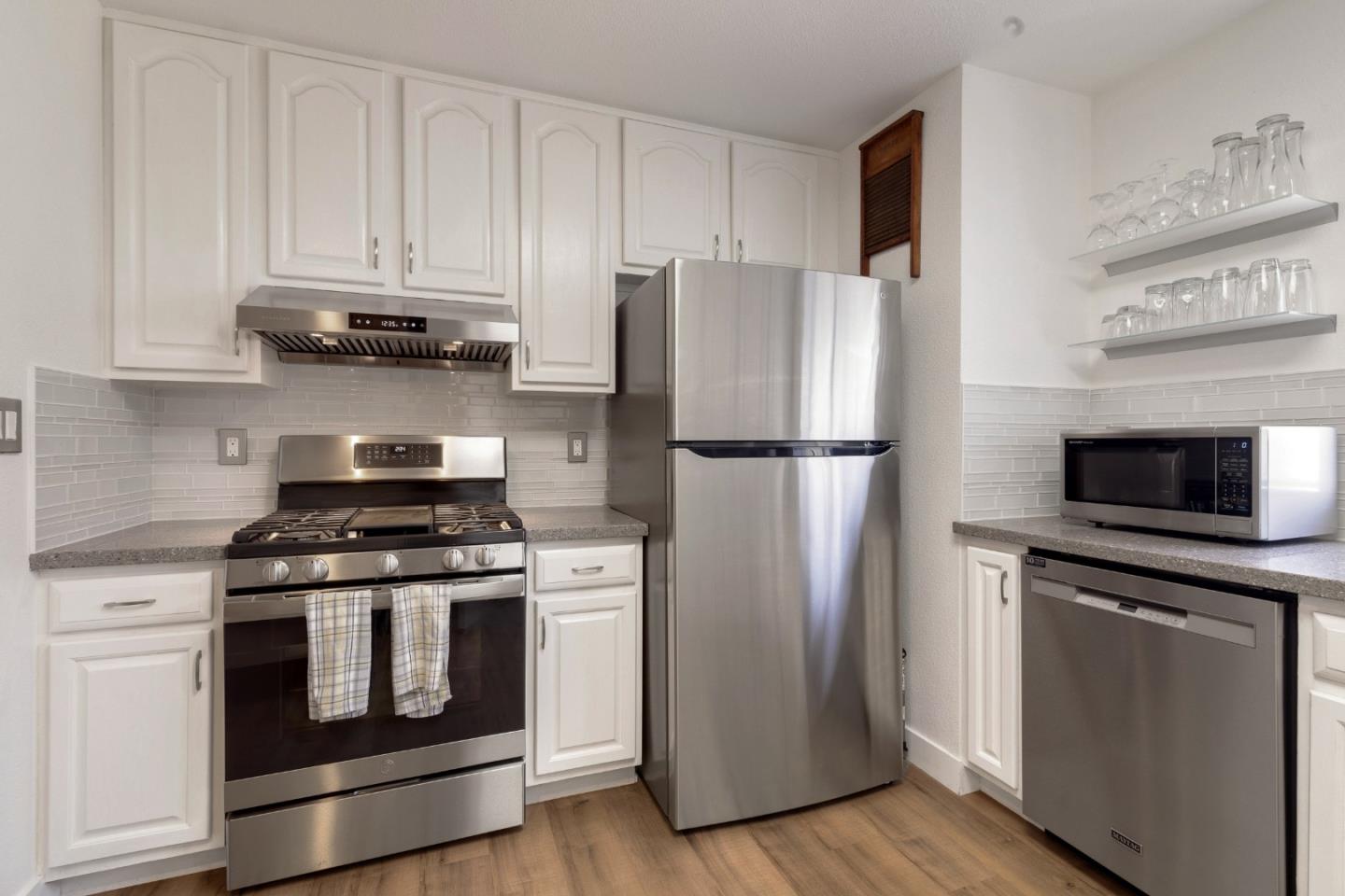 174 Pacific Avenue Pacifica, CA 94044 - Photo 14 of 31 a kitchen with a stove and a refrigerator