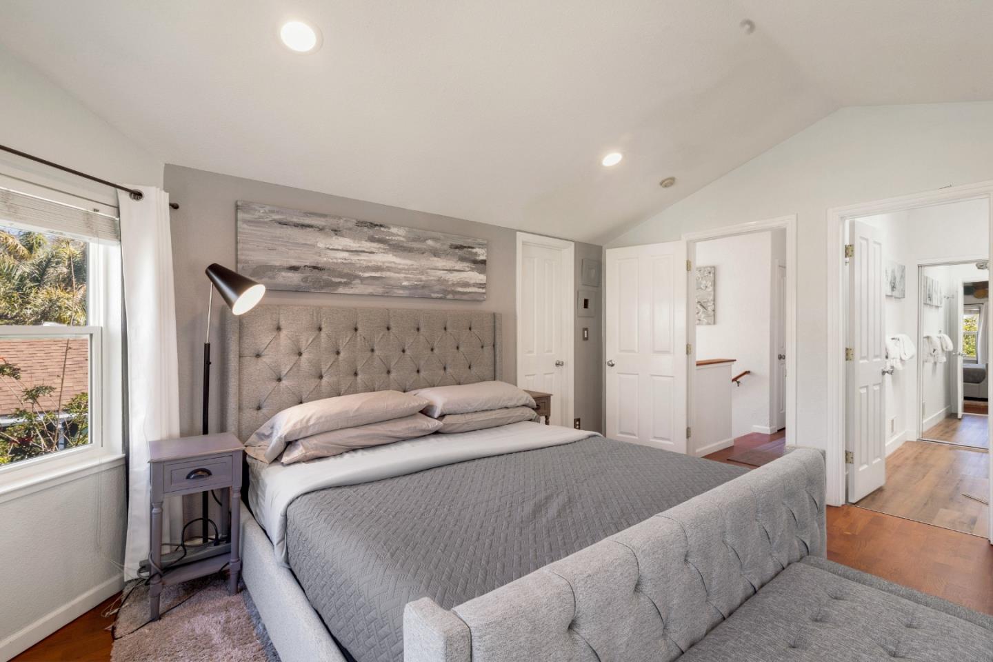 174 Pacific Avenue Pacifica, CA 94044 - Photo 18 of 31 a bedroom with a bed and a window