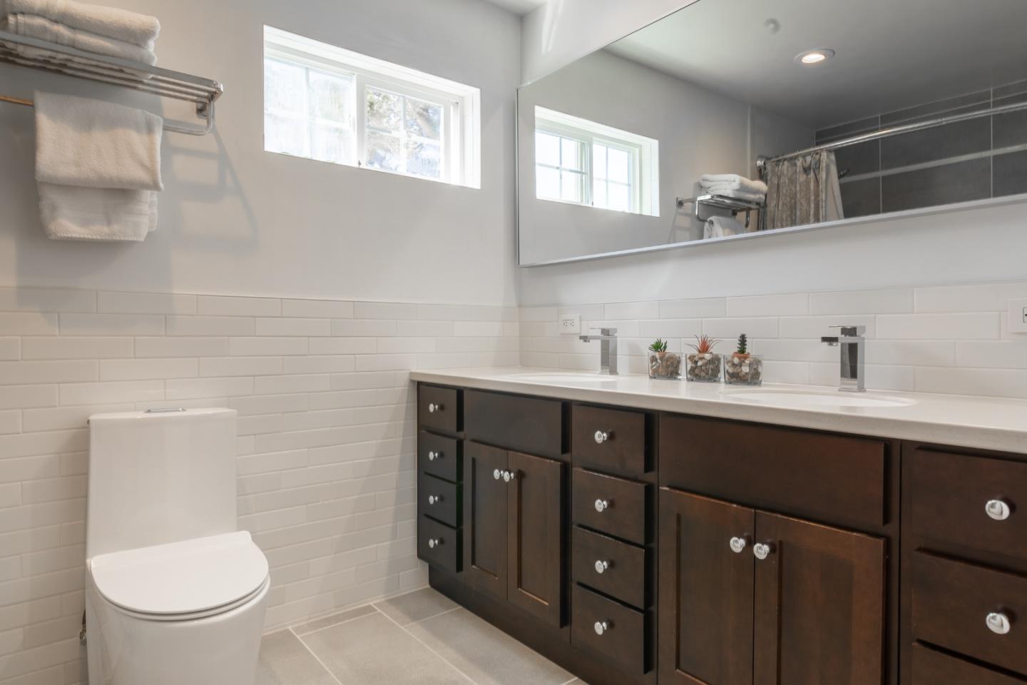 174 Pacific Avenue Pacifica, CA 94044 - Photo 23 of 31 a bathroom with a toilet sink and mirror