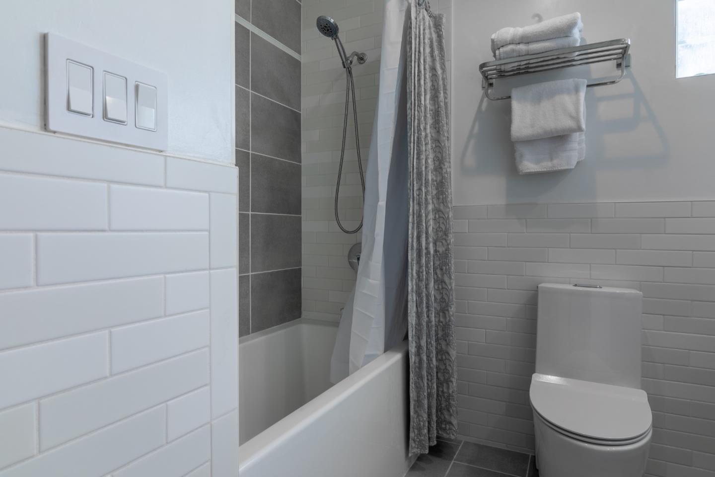 174 Pacific Avenue Pacifica, CA 94044 - Photo 24 of 31 a bathroom with a toilet and a shower