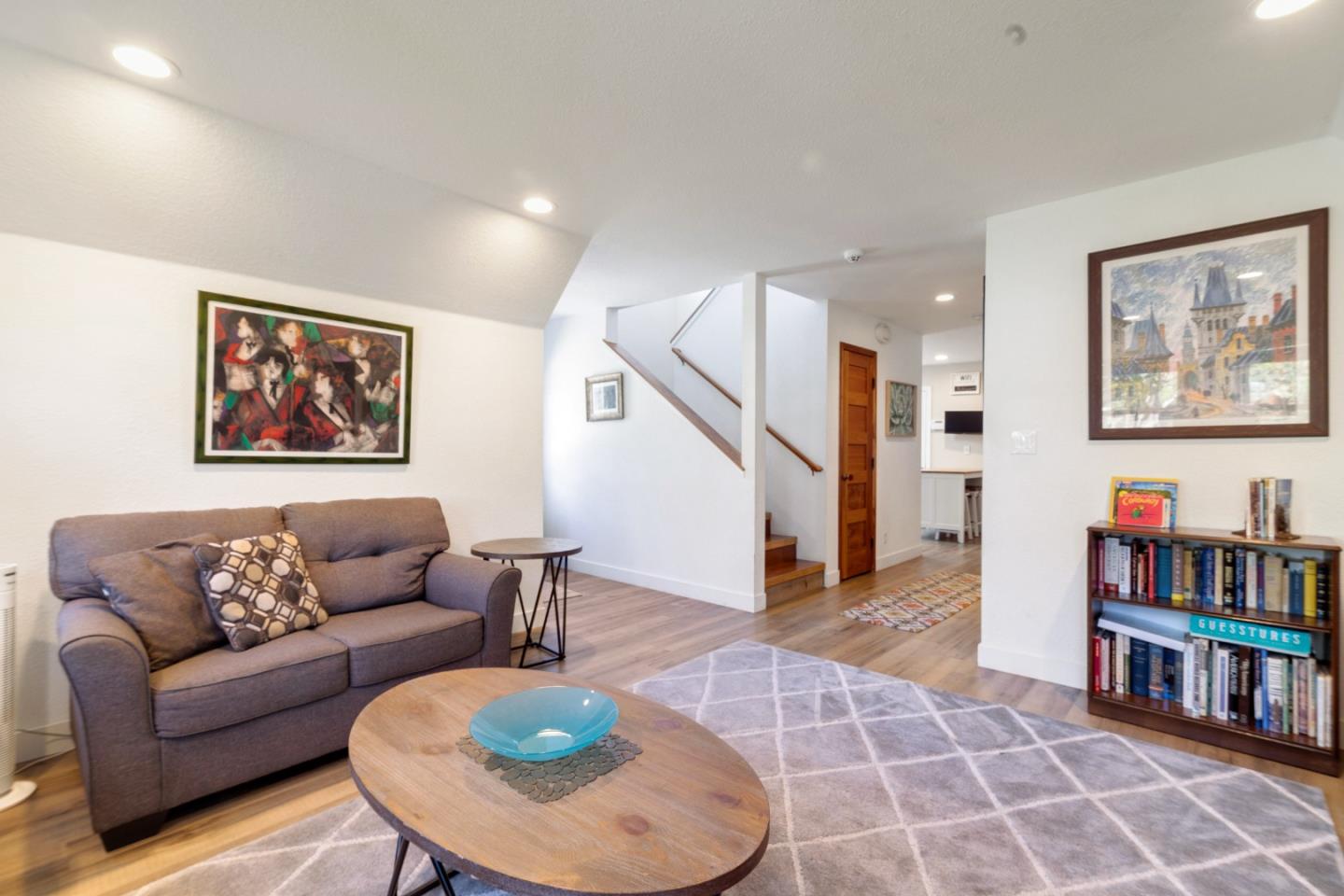 174 Pacific Avenue Pacifica, CA 94044 - Photo 9 of 31 a living room with furniture and a book shelf