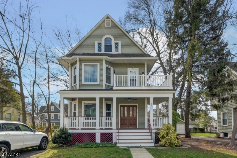 558 Summit Avenue, Unit 1 Westfield, NJ 07090 - Photo 1 of 13 a front view of a house with garden