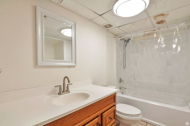 1057 North 700 West Clinton, UT 84015 - Photo 11 of 15 Bathroom featuring vanity, a drop ceiling, and bathing tub / shower combination