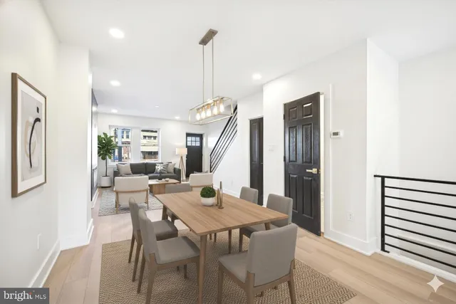 a dining room with furniture and window