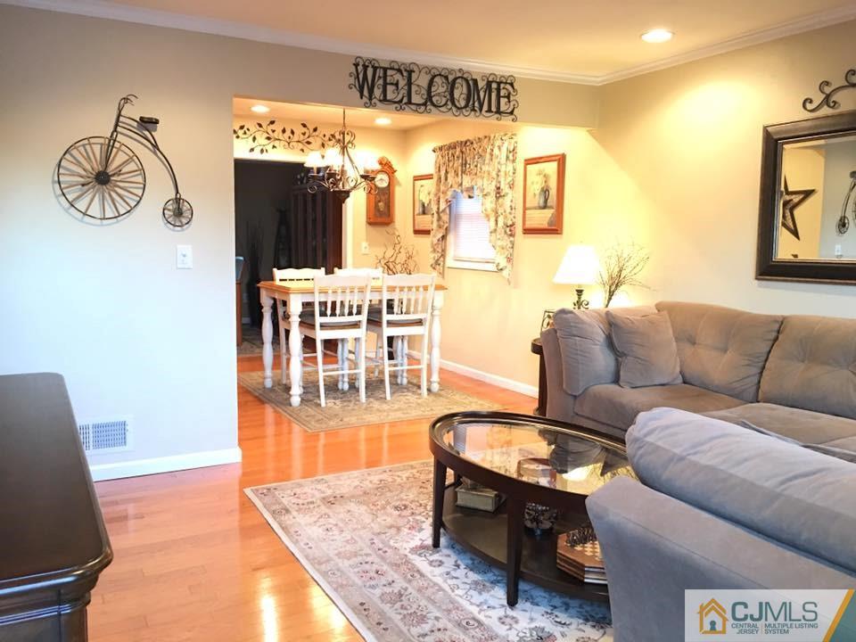 17 Wilshire Road Edison, NJ 08817 - Photo 2 of 19 a living room with furniture and a table