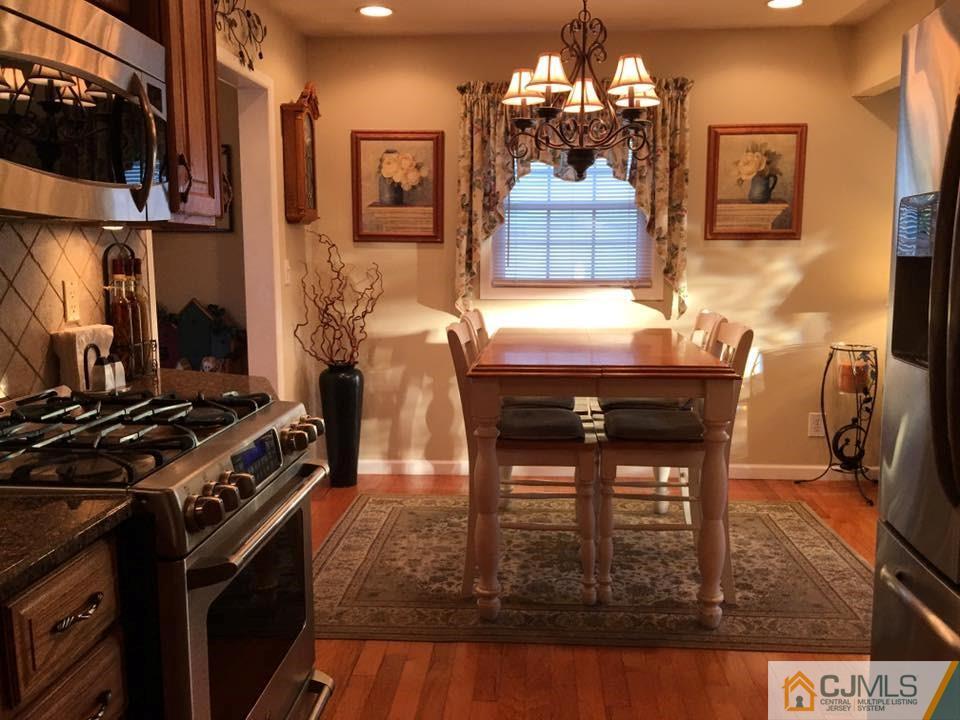17 Wilshire Road Edison, NJ 08817 - Photo 4 of 19 a dining room with furniture and chandelier