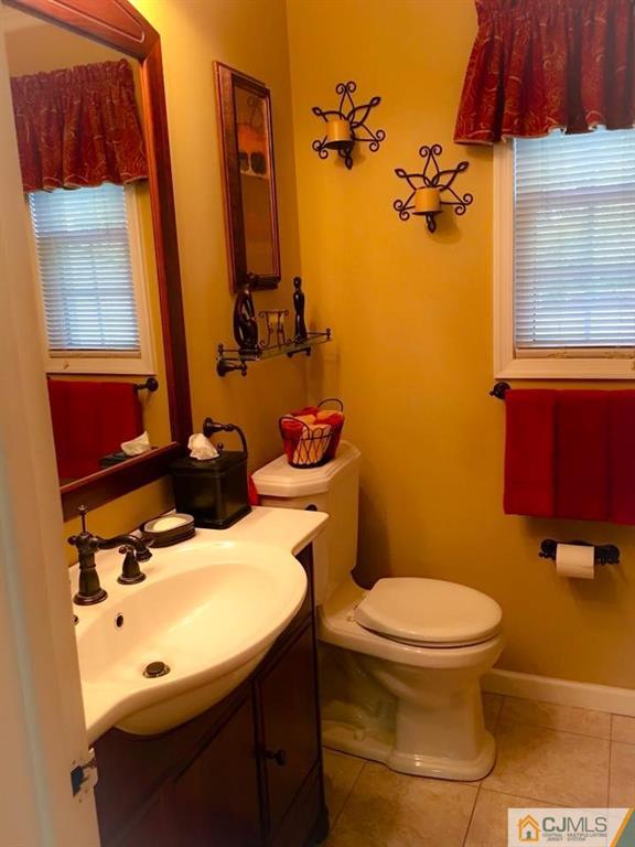 17 Wilshire Road Edison, NJ 08817 - Photo 9 of 19 a bathroom with a sink toilet and mirror