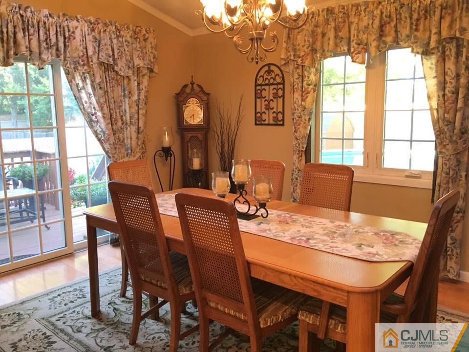 17 Wilshire Road Edison, NJ 08817 - Photo 10 of 19 a view of a dining room with furniture and wooden floor