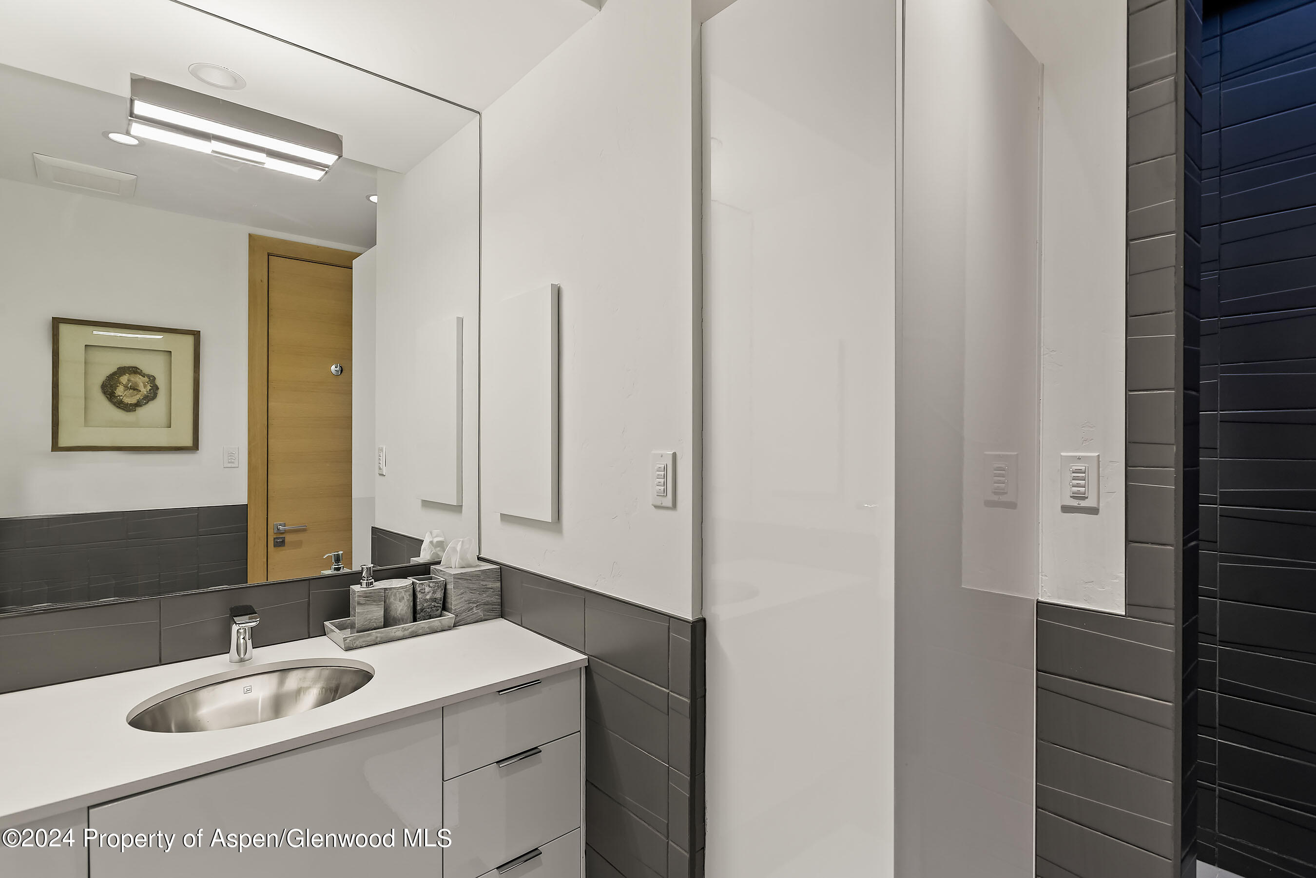1190 Riverside Drive Aspen, CO 81611 - Photo 22 of 31 a bathroom with a sink and a mirror