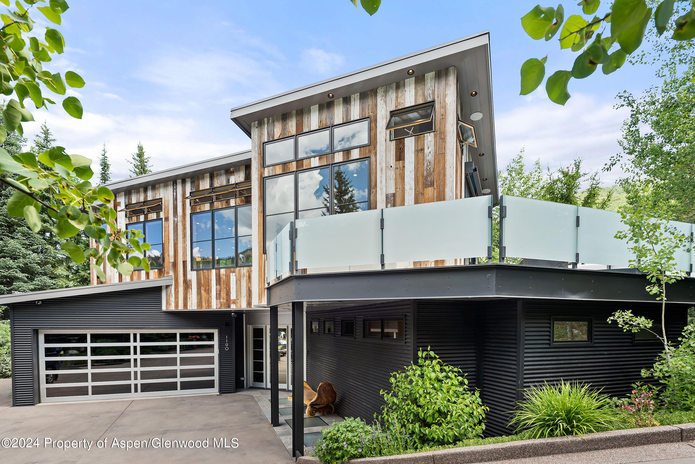 1190 Riverside Drive Aspen, CO 81611 - Photo 26 of 31 a front view of a house with plants