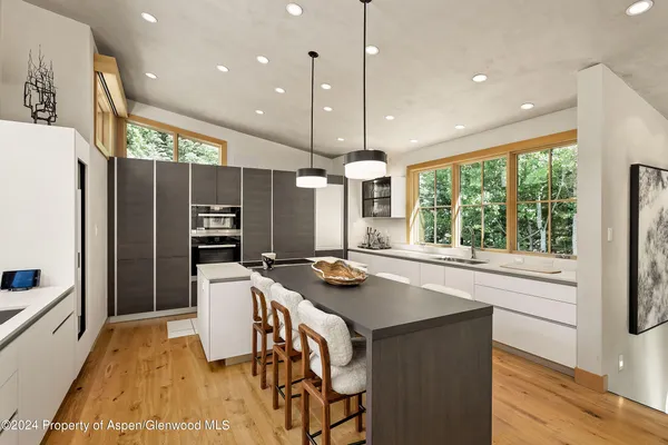 a kitchen with stainless steel appliances granite countertop counter space and a refrigerator