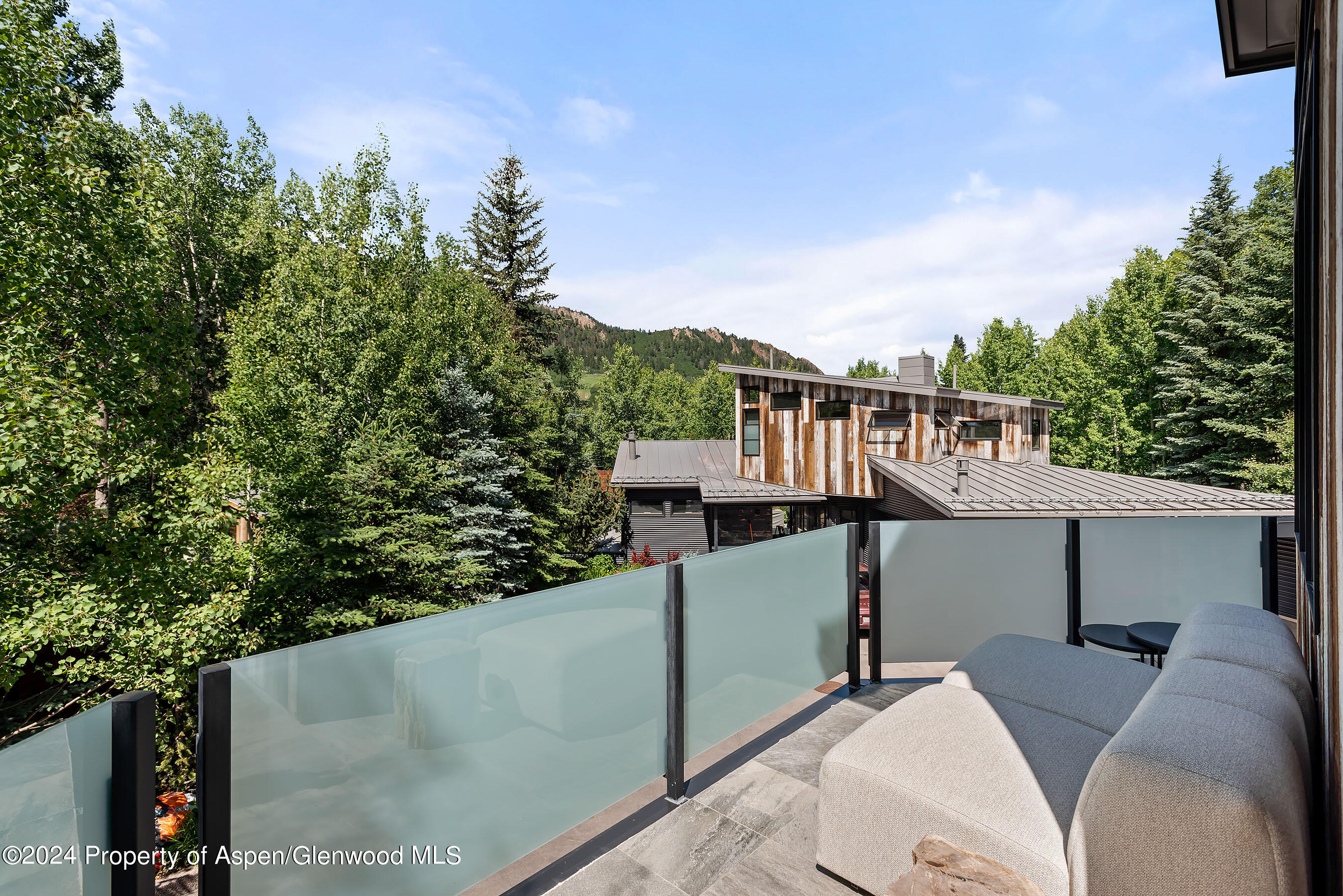 1190 Riverside Drive Aspen, CO 81611 - Photo 9 of 31 a view of a balcony with wooden fence and floor