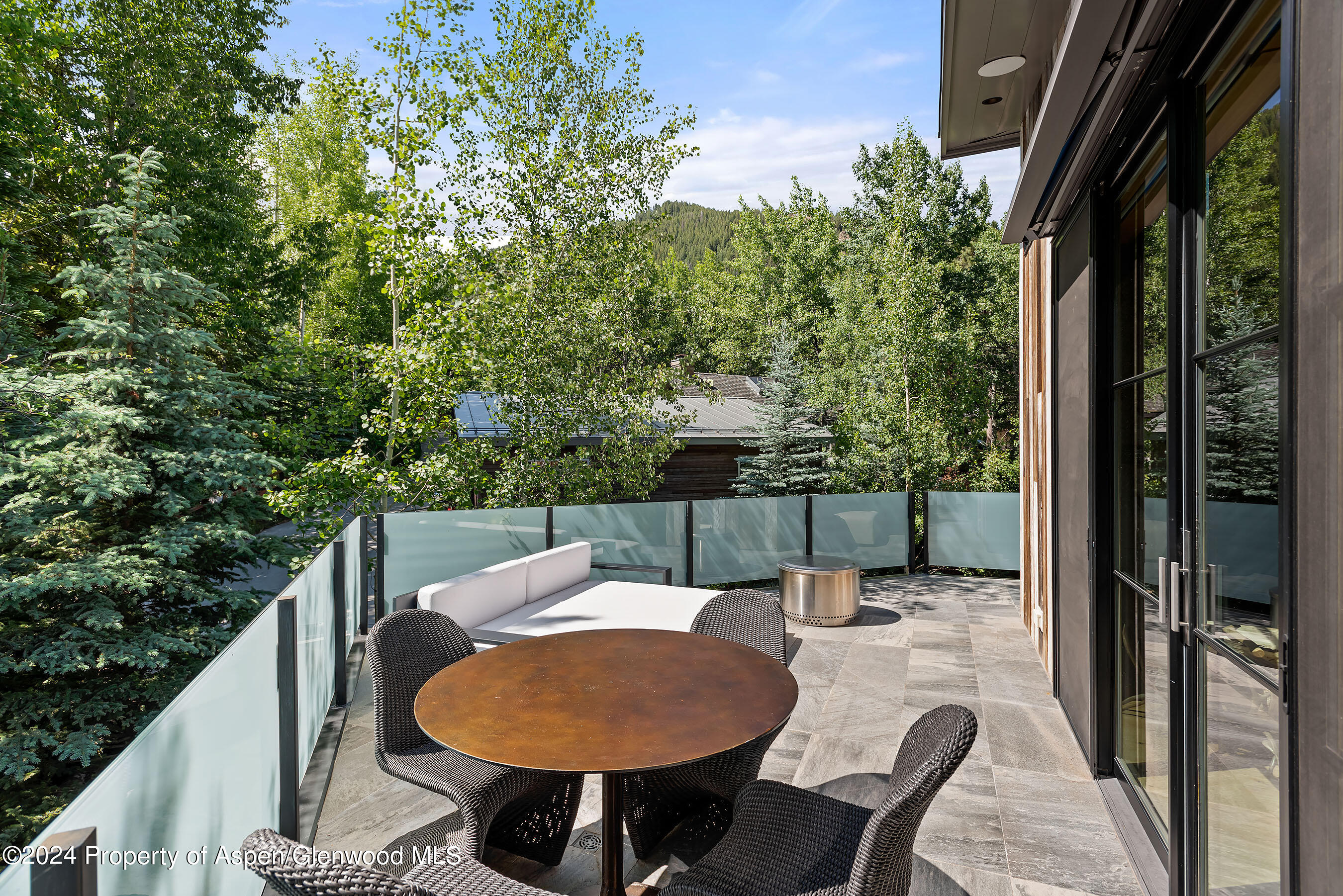 1190 Riverside Drive Aspen, CO 81611 - Photo 10 of 31 a balcony with table and chairs