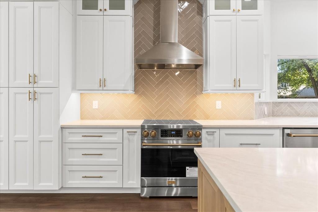 3801 Berry Hill Court Double Oak, TX 75028 - Photo 14 of 33 a kitchen with a stove and a refrigerator