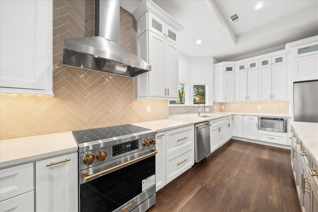 3801 Berry Hill Court Double Oak, TX 75028 - Photo 17 of 33 a kitchen with a stove oven and sink