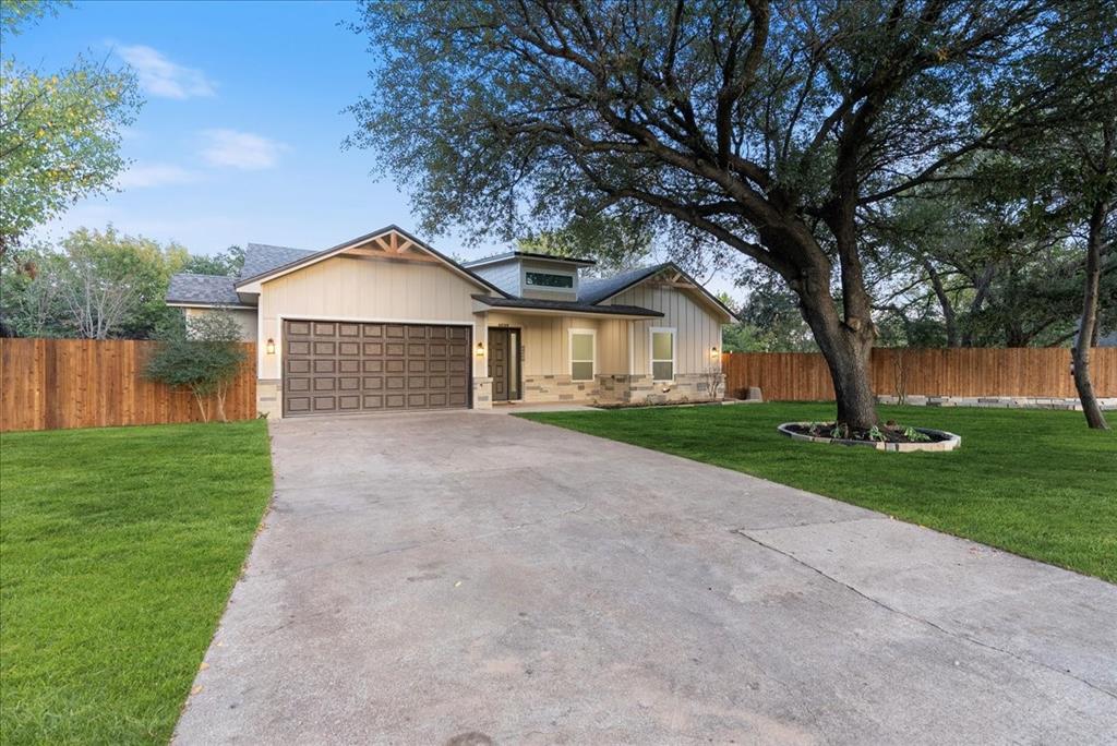 3801 Berry Hill Court Double Oak, TX 75028 - Photo 2 of 33 a front view of a house with garden